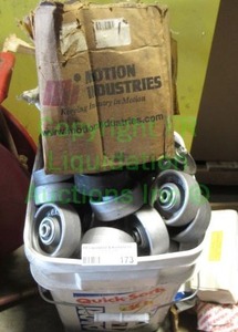 lot 173 image: cast iron roller wheels, bucket full