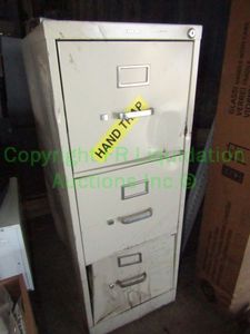 lot 313 image: Metal file cabinet (is damaged)