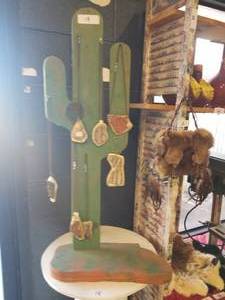 lot 19 image: Cactus display stand with jewelry