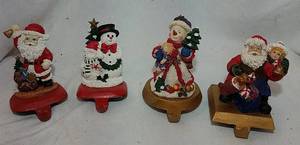 lot 213 image: 4 Cast Iron Stocking Holders