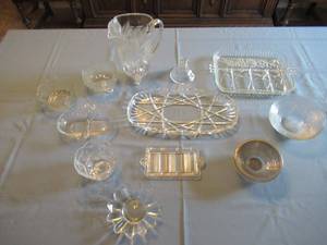 lot 29 image: GLASSWARE INCLUDING 9 PITCHER, 15 SERVING DISHES, CANDY DISHES AND MORE. POSSIBLY SOME UNMARKED CRYSTAL