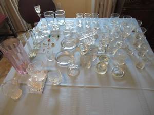 lot 34 image: GLASSWARE INCLUDING KATE SPADE PINK COLRED MARGARITA MIXING PITCHER WITH STIR STICK, ASSORTMENT OF WINE GLASS CHARMS, CANDLESTICK HOLDERS, JUICE GLASSES, CANDY DISHES  AND MUCH MORE. COME PREVIEW