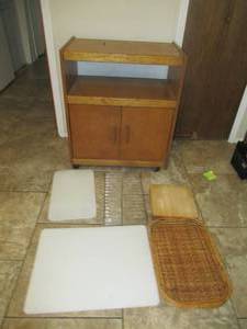 lot 52 image: SERVERMICROWAVE STAND SOLID WOOD 28 X 17 X 34, 4 WICKER SERVING TRAYS, HDPE CUTTING BOARD 24 X 18  AND MORE