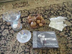 lot 57 image: BED, BATH AND BEYOND CANDLE SEA SHELL DISH, PROFESSIONAL CORKSCREW, FAUX WOODEN FRUIT DISPLAY AND CERAMIC FISH CANLE HOLDER