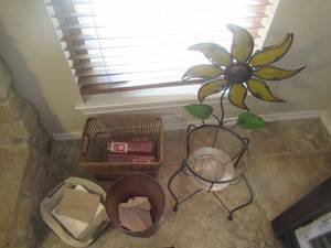 lot 62 image: BEAUTIFUL IRON WITH SUNFLOWER PLANT STAND 33, TRASH CAN, ORNATE BASKET WITH HANDLES AND WICKER BASKET WITH 5 SCENTED HOLIDAY CANDLES