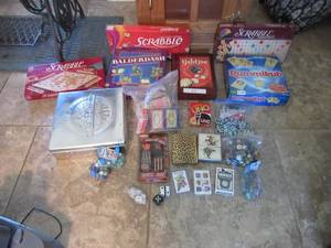 lot 65 image: YAHTZEE, RUMMIKUB, BALDERDASH, CRANIUM, DICE UNO , PLAYING CARDS, POKER CHIPS, MARBLES AND MORE