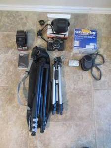 lot 75 image: OLYMPUS STYLUS 300 DIGITAL CAMERA, PENTAX 35MM K1000 CAMERA, VIVITAR AUTO THYRISTOR 550 FD FLASH, ADJUSTABLE COAST TRIPOD AND HAKUBA 100 TRIPOD