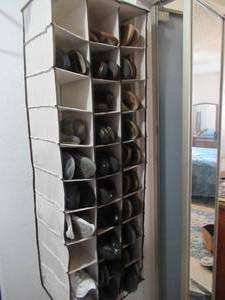 lot 109 image: SEVERAL PAIRS OF WOMENS LEATHER BIRKENSTOCK SANDELS, TENNIS SHOES, SLIDES, WALKING SHOES, SLIP ONS, JUSTIN AND LAREDO BOOTS SIZES 8-9. AND HANGING SHOE HOLDER