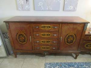 lot 110 image: ANTIQUE CHERRY DRESSER WITH 4 DRAWERS AND 2 STORAGE SPACES 63 X 21 X 38. HAND CARVED INLAY WAS BOUGHT FROM CHRISTIES AUCTION HOUSE IN THE 90S. MATCHES LOTS 111, 112 ,113  AND 114.