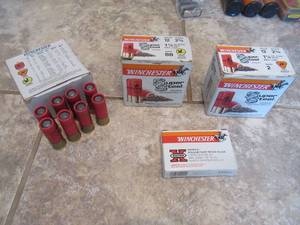 lot 148 image: 8 WINCHESTER DEER SLUGS, WINCHESTER 12 GA. BB STEEL SHOT FOR GOOSE BOX 5 MISSING IN BOX, WINCHESTER 12 GA. STEEL SHOT NO. 2 SHOT FOR DUCK FULL BOX, WINCHESTER 12 GA. HOLLOW POINT RIFLED SLUGS 5 IN BOX AND 8 WINCHESTER 6 SHOT IN CAMO CARRYING CASE