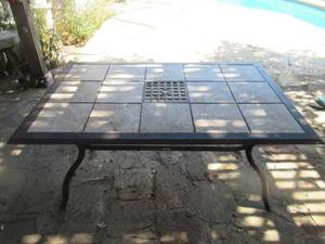 lot 186 image: HAMPTON BAY OUTDOOR TABLE 65 X 41 X 28. THE TABLE HAS REMOVABLE 12 TILES THAT CAN BE CHANGED OUT.