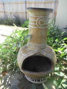 lot 189 image: OUTDOOR WOOD-BURNING CLAY CHIMINEA ON SMALL ROLL AROUND DOLLY 37 AND 2 CEMENT PLANT STANDS 17