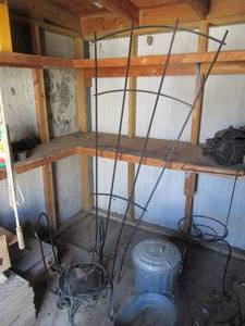 lot 191 image: VINE TRESTLE, SMALL TROUGH, SMALL TRASH CAN, FIREWOOD HOLDER AND SEVERAL PLANT STANDS