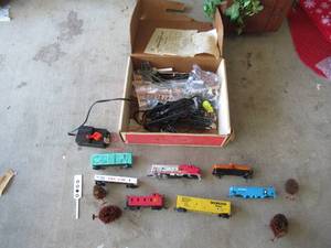lot 223 image: TRAIN SET WITH ENGINE, BOX CARS, CABOOSE, MINI PEOPLE, TREES, TRACKS AND CONTROLLER