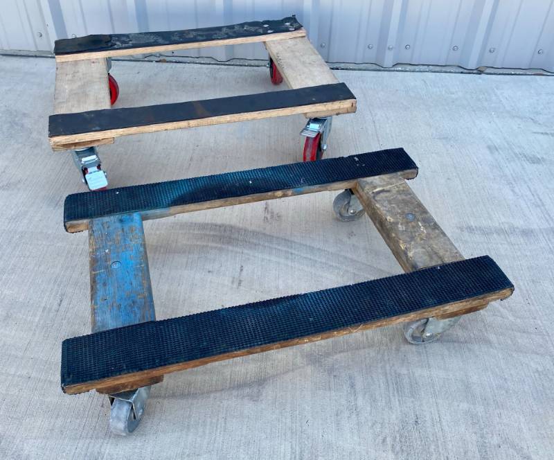 lot 101 image: 2 Wood furniture moving Dollys with Wheels one has locking wheels