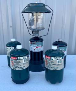 lot 67 image: Ozark Trail Propane Lantern with extra propane cans