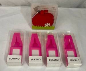 lot 117 image: 2 P&G Red Design POCHI Silicone Accessory and 4 Bokuno Silicone Name Tags
