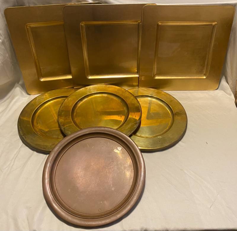 lot 142 image: 3 Towle Silversmiths Gold Finish Plastic Square Chargers, 7 Round Gold Charger plates, and 1 Bronze color Charger plate
