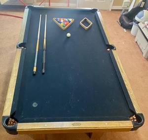 lot 7 image: Olhausen Pool Table with 2 Pool sticks, 9 ball rack and 8 ball rack