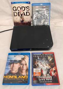 lot 23 image: Samsung Blu-Ray Disc Player Model no. BD-F-5100 & 4 Blu-Ray Discs