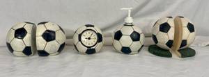 lot 62 image: Pier 1 Soccer Ball Bookends, Clock and SoapLotion Dispenser and Side kicks Soccer Ball Bookends
