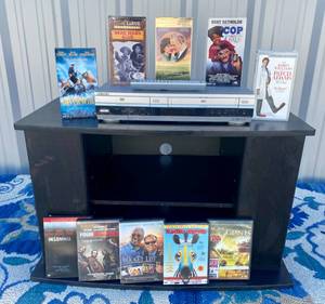 lot 123 image: TV Stand, DVDVCR, 5 VHS Movies and 5 DVD movies