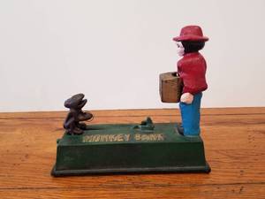 lot 129 image: Cast iron mechanical bank