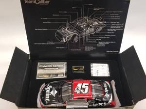 lot 5 image: Kyle Petty Team Caliber 124 diecast car - Autographed  - Authenticity unknown