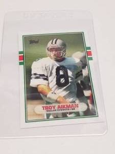 lot 182 image: Troy Aikman Topps Rookie card #70T