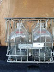 lot 4 image: Borden 1 Gallon glass milk jugs in metal bin from Bordens in Abilene - 1971