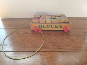 lot 233 image: Vintage pull behind toy wagon with blocks