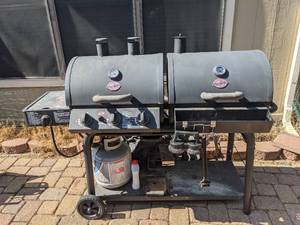 lot 5 image: LP Gas & Charcoal Grill, Duo Model #5050, comes with propane tank and grill tools.