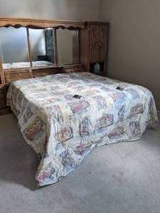 lot 34 image: Sleep Number Bed P5 Performance Series King on second floor Size Bed with two fully functioning remotes. Designed and crafted in the USA. Dual Air Technology inside. Comes with mattress, box spring, foam topper, mattress covers, sheets and comforter.