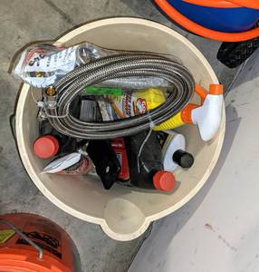 lot 55 image: 2 bottles of 10W-30 oil and others miscellaneous items with bucket included.