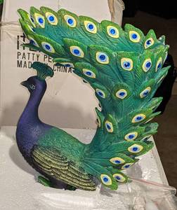 lot 98 image: Patty Peacock in Box. Approximately 10 inches tall and 9 inches wide.