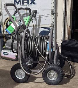 lot 100 image: Water Hose Cart with Hose and an extra Inner Tube.
