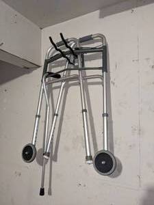 lot 103 image: Walker and Cane. Wall hooks not included.