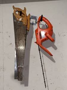 lot 104 image: Two saws and a Hedge Trimmer. Wall hooks not included.