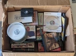 lot 84 image: 2 Boxes with DVD, CD, and VHS tapes.