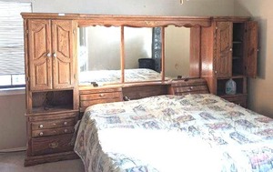 lot 33 image: Pacific Frames Ind, Wood Storage Headboard with drawers and lights. 130 inches wide, 75 inches tall and 21 inches deep.