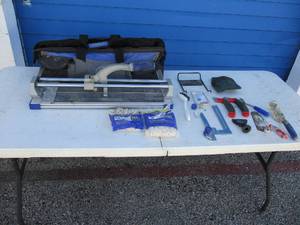 lot 34 image: KOBALT 28 x 8 Title Cutter In Travel Bag With Tools And Extras