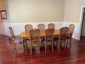 lot 29 image: Dining Room Table With 2-Leafs, 2- Pressed Back Wicker Arm Chairs  And 6- Pressed Wicker Back Side Chairs
