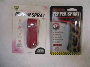 lot 69 image: HIS AND HERS -PEPPER SPRAY, 1-GUARD DOG AND  1-CHEETAH, WITH STYLISH KEYCHAINS