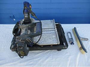 lot 73 image: Kobalt-Model KB-7005, 7-in, 9-Amp, 110-V,  Table Top -Sliding Table Tile Saw, With Water Pan And Pump