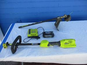 lot 86 image: RYOBI EXPAND-IT, Base with 40-V Battery, Charger And Weed Eater Attachment Tool