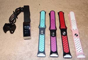 lot 134 image: FITBIT WATCH WITH CHARGER & ASSORTMENT OF BANDS - TESTEDWORKS