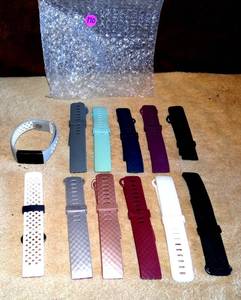 lot 170 image: FITBIT WATCH WITH CHARGER & ASSORTMENT OF BANDS - TESTEDWORKS