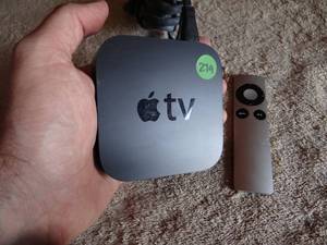 lot 279 image: APPLE TV STREAMING DEVICE WCHARGER