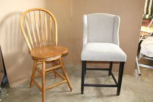 lot 167 image: 2 Bar Height Chairs One is Upholstered the other is Wooden Swivel Type