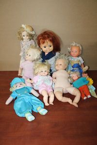 lot 148 image: Assortment of Dolls-used for parting out or clean up. Some in various stages of working.